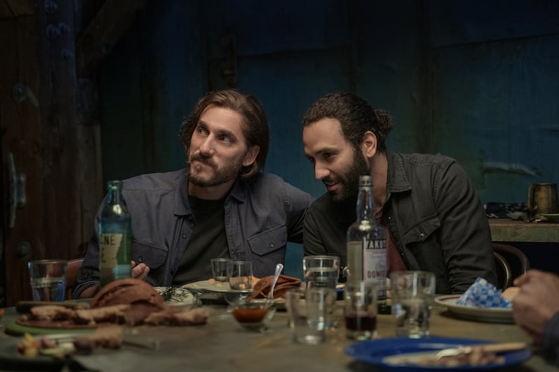Luca Marinelli as Nicky and Marwan Kenzari as Joe