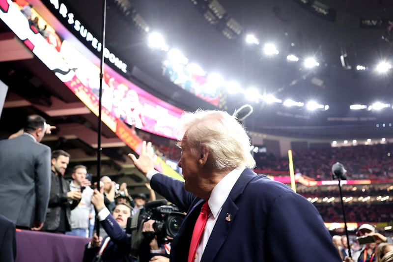 Donald Trump waves to the crowd from the field prior to Super Bowl LIX between the Kansas City Chiefs and the Philadelphia Eagles at Caesars Superdome on February 09, 2025.