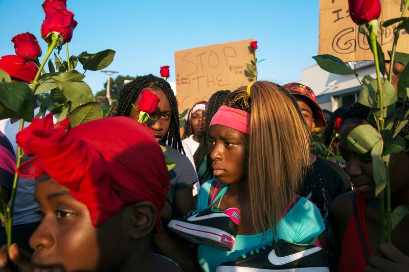 articles/2014/08/19/from-ferguson-cop-embroiled-in-a-brutality-suit-to-city-councilwoman/140819-ferguson-missouri-riots-update7_cmj5g5