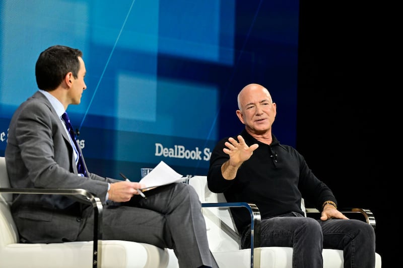(L-R) Andrew Ross Sorkin and Jeff Bezos speak onstage during The New York Times Dealbook Summit 2024 at Jazz at Lincoln Center on December 04, 2024 in New York City.