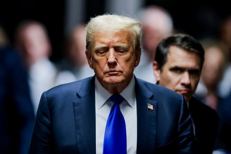 Former U.S. President Donald Trump departs the courtroom after being found guilty on all 34 counts in his hush money trial at Manhattan Criminal Court on May 30, 2024 in New York City.