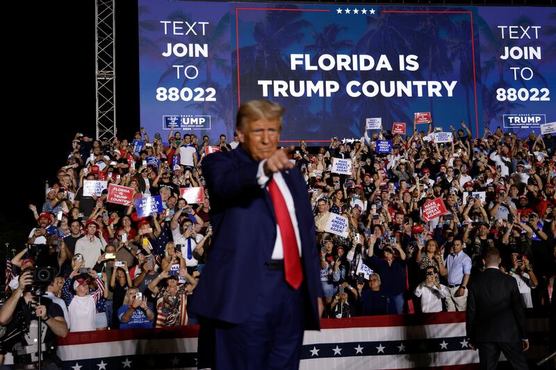 Donald Trump stands on stage during a rally at The Ted Hendricks Stadium at Henry Milander Park on November 8, 2023 in Hialeah, Florid
