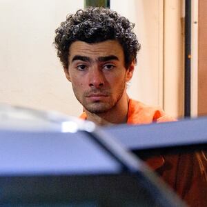 Suspected shooter Luigi Mangione is led from the Blair County Courthouse after an extradition hearing December 10, 2024 in Hollidaysburg, Pennsylvania.