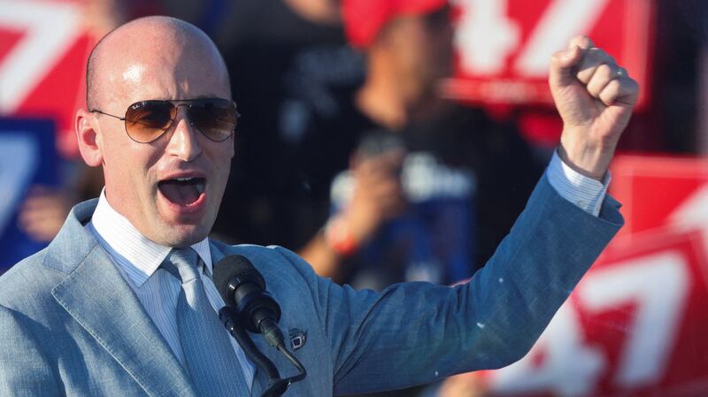 Stephen Miller, Trump's campaign advisor, raises his fist as he speaks during a rally for Republican presidential nominee and former U.S. President Donald Trump, in Coachella, California, U.S., October 12, 2024.  REUTERS/Mike Blake