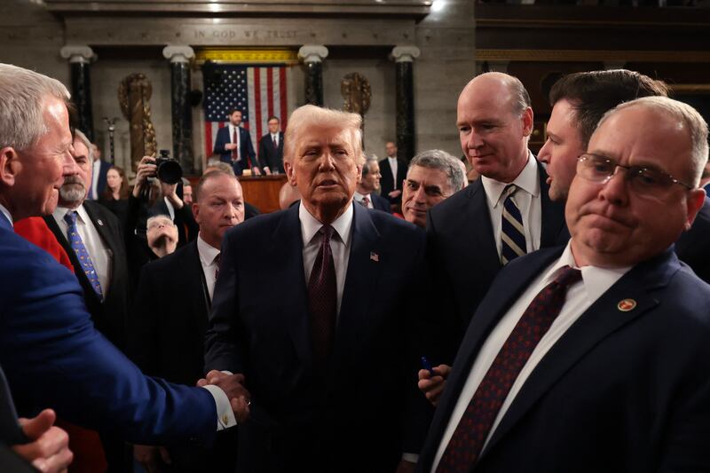 US President Donald Trump greets lawmakers as he leaves after addressing a joint session of Congress at the US Capitol in Washington, DC, on March 4, 2025.