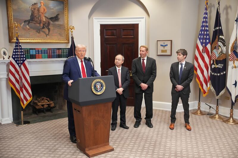 U.S. President Donald Trump speaks in the Roosevelt Room of the White House while SoftBank CEO Masayoshi Son, Oracle CTO Larry Ellison, and OpenAI CEO Sam Altman look on on January 21, 2025 in Washington, DC.