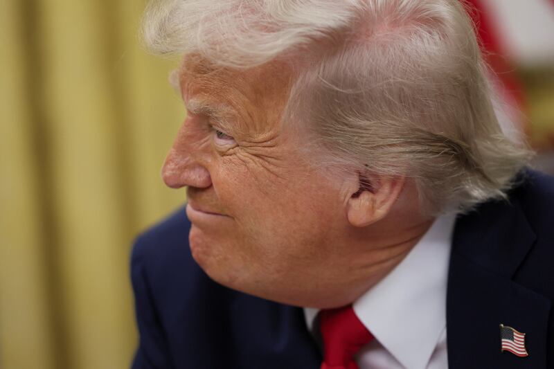 President Donald Trump reacts on the day he signs an executive order in the Oval Office at the White House in Washington, D.C. on March 31, 2025.
