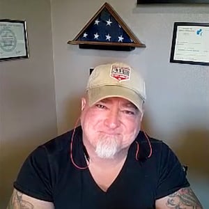 Luis Elizondo in a baseball cap