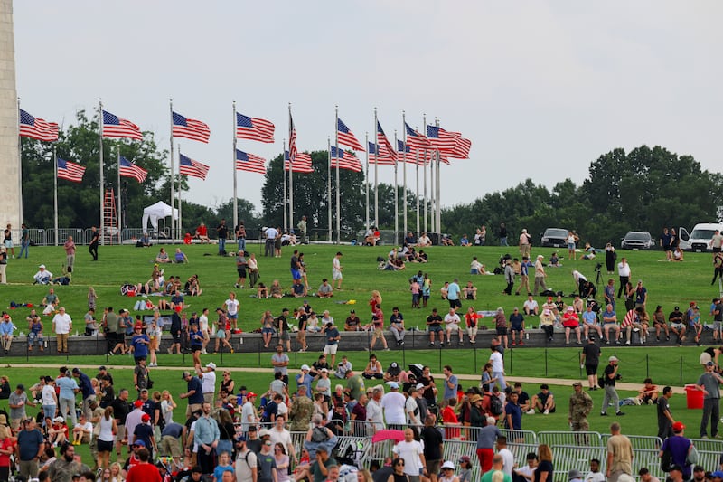 People gather to watch the U.S. Army's 250th Birthday parade, on the same day of U.S. President Donald Trump 79th birthday, in Washington, D.C., U.S., June 14, 2025.
