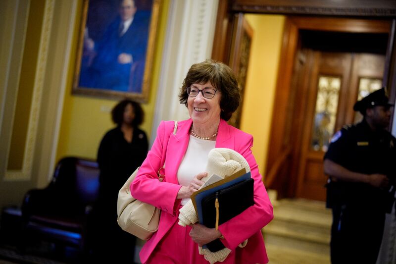 Sen. Susan Collins holds a blanket as she walks off the Senate floor after the Senate stayed in session throughout the night at the U.S. Capitol Building on July 1, 2025. Collins was one of three Republicans who voted against the Senate bill.