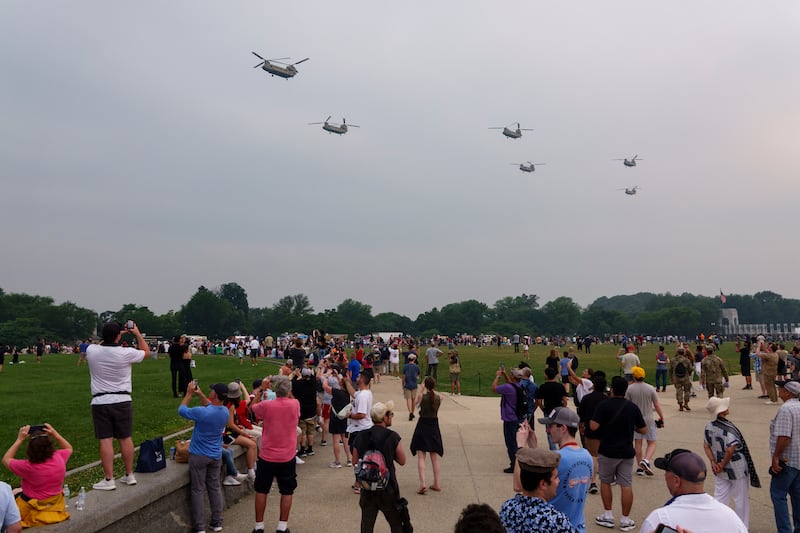 U.S. Army CH-47 Chinook helicopters fly across the National Mall during the 250th birthday parade on June 14, 2025 in Washington, DC. The U.S. Army is marking its 250th birthday with a military parade including roughly 6,600 troops, 150 vehicles, and over 50 aircraft.  The parade, which coincides with President Donald Trump's 79th birthday, is designed to tell the history of the Army.