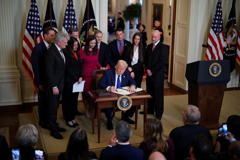 U.S. President Donald Trump signs the Laken Riley Act at the White House in Washington, U.S.,  January 29, 2025. REUTERS/Carlos Barria     TPX IMAGES OF THE DAY
